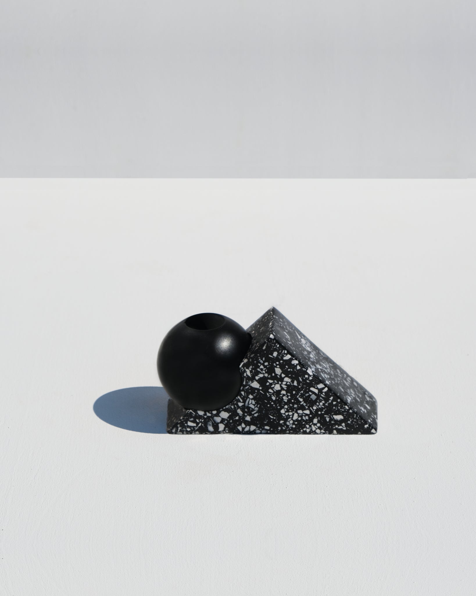 Equilibrium candle holder, black terrazzo style