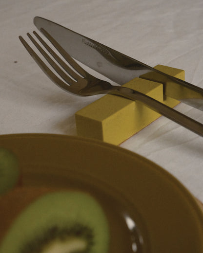 Alkaline minimalist resin cutlery rest – Muted Lime – lifestyle shot
