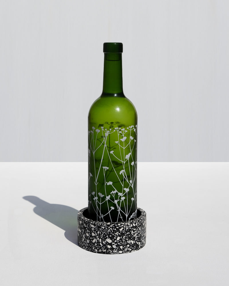 Alkaline round terrazzo resin wine bottle holder – Black – lifestyle table