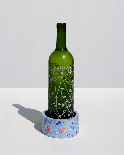 Alkaline round terrazzo resin wine bottle holder – Pastel Blue – bottle styled